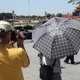 Illustration for article titled Chinese Cops Block Cameras With Umbrellas On Tiananmen Square 20th Anniversary